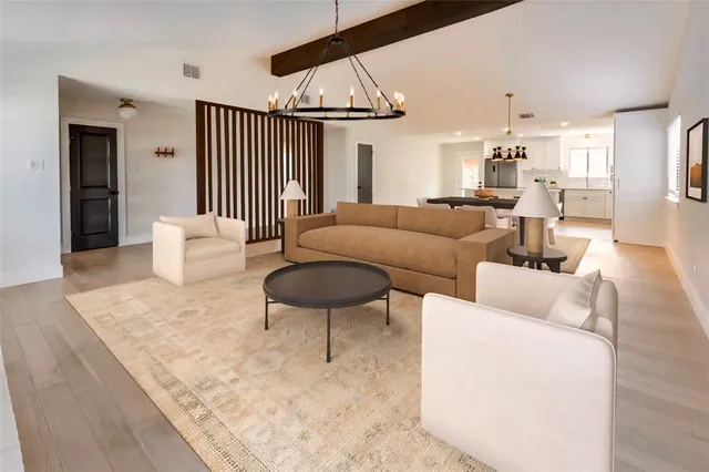 a living room with furniture and a table