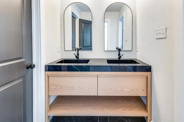 an empty room with ceiling fan and window