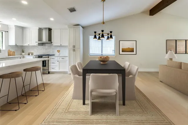a view of kitchen with cabinets and wooden floor
