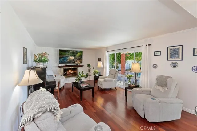 a living room with furniture or couch and a wooden floor