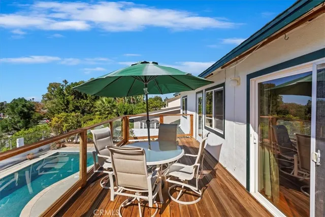a view of balcony with outdoor seating and wooden floor