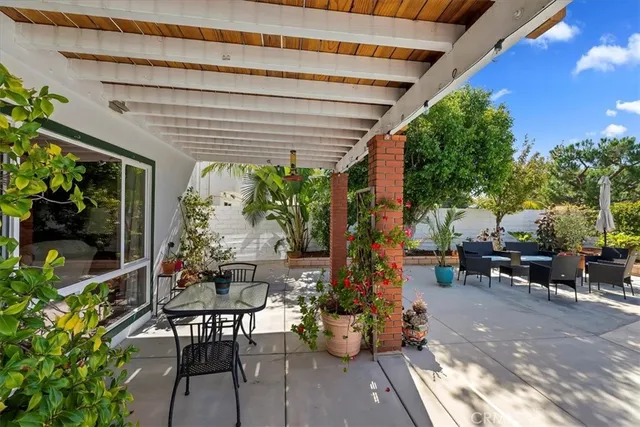 a outdoor living space with patio furniture and potted plants