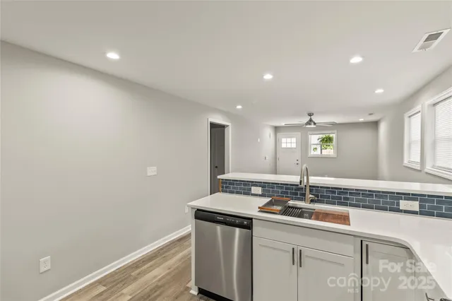 a room with a bed and a lamp on table