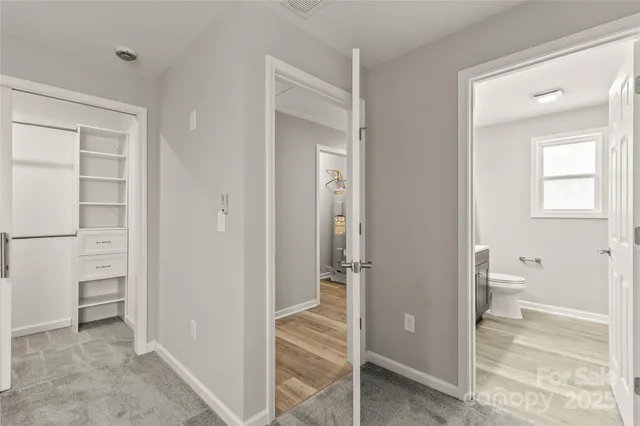 a room with a bed and a window