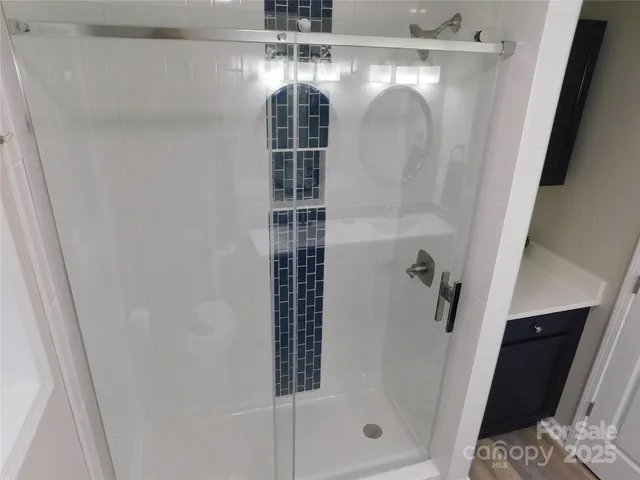 a bathroom with a sink a mirror a toilet and a mirror