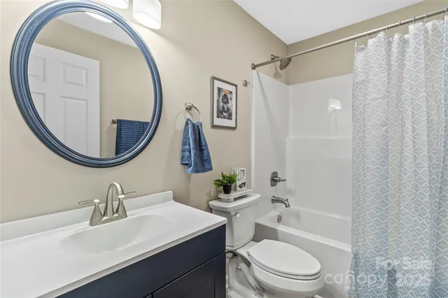 a kitchen with a stove a sink and a microwave