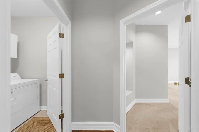 a view of a bathroom with a tub and shower