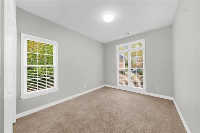 an empty room with windows