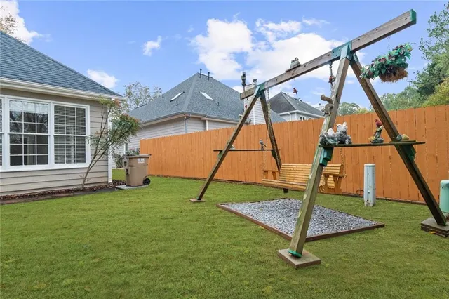 a house that has a lots of trees in it