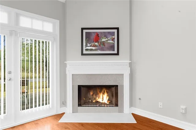 a living room with a fireplace and a window