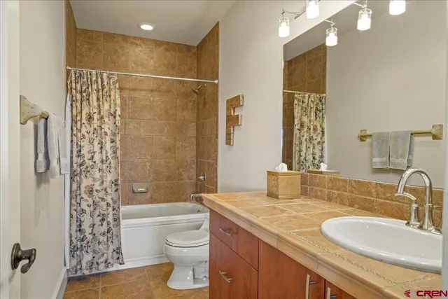 a bed room with a bed and a chair