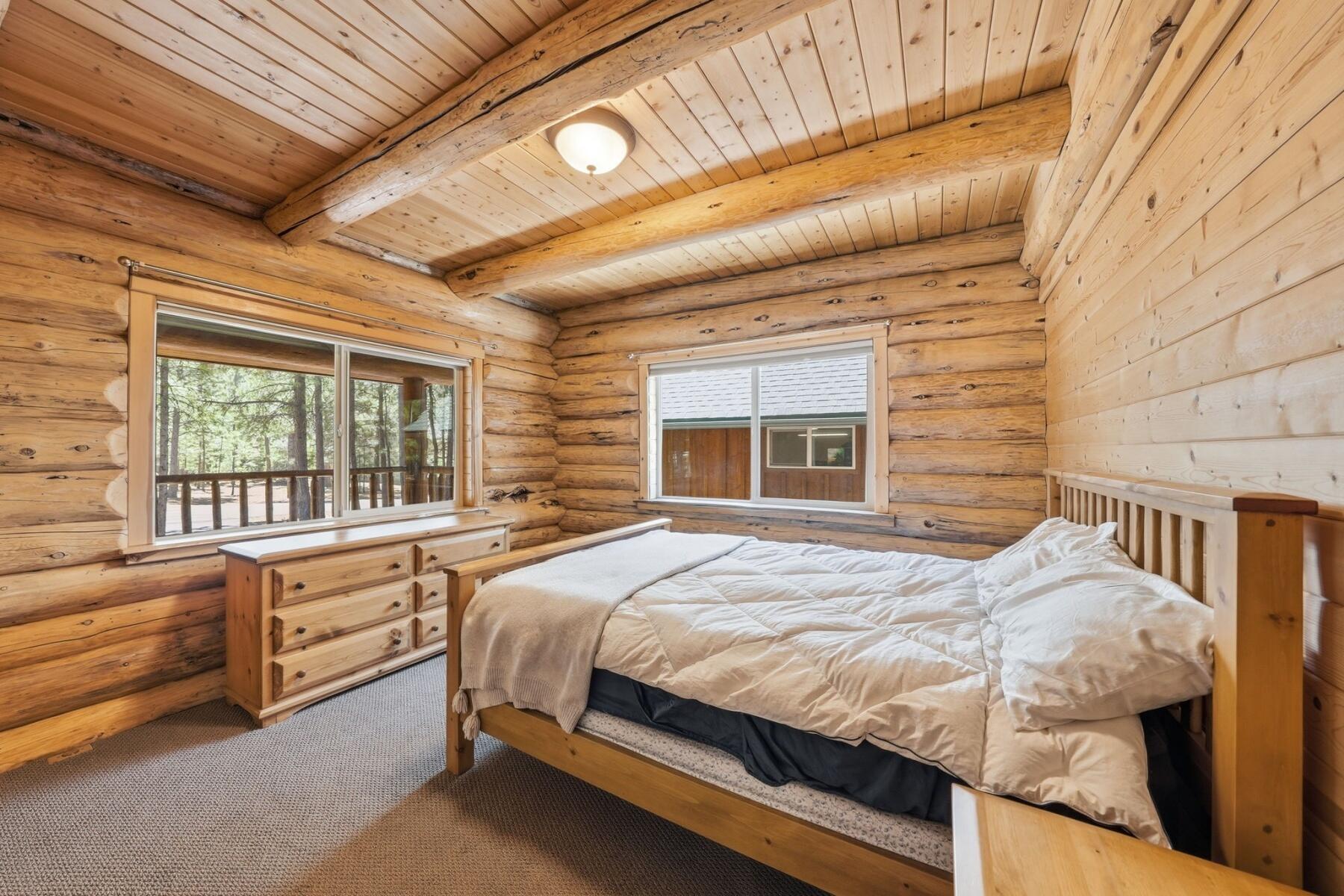 14177 Whitewater Loop La Pine, OR 97739 - Photo 10 of 38 a bed sitting in a bedroom next to a window