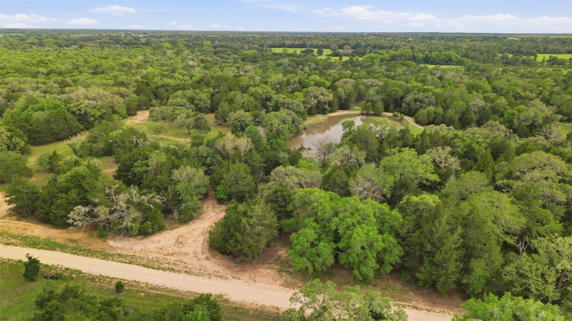 1165 Cr 213 Road Weimar, TX 78962 - Photo 25 of 50 a view of a city with lush green forest
