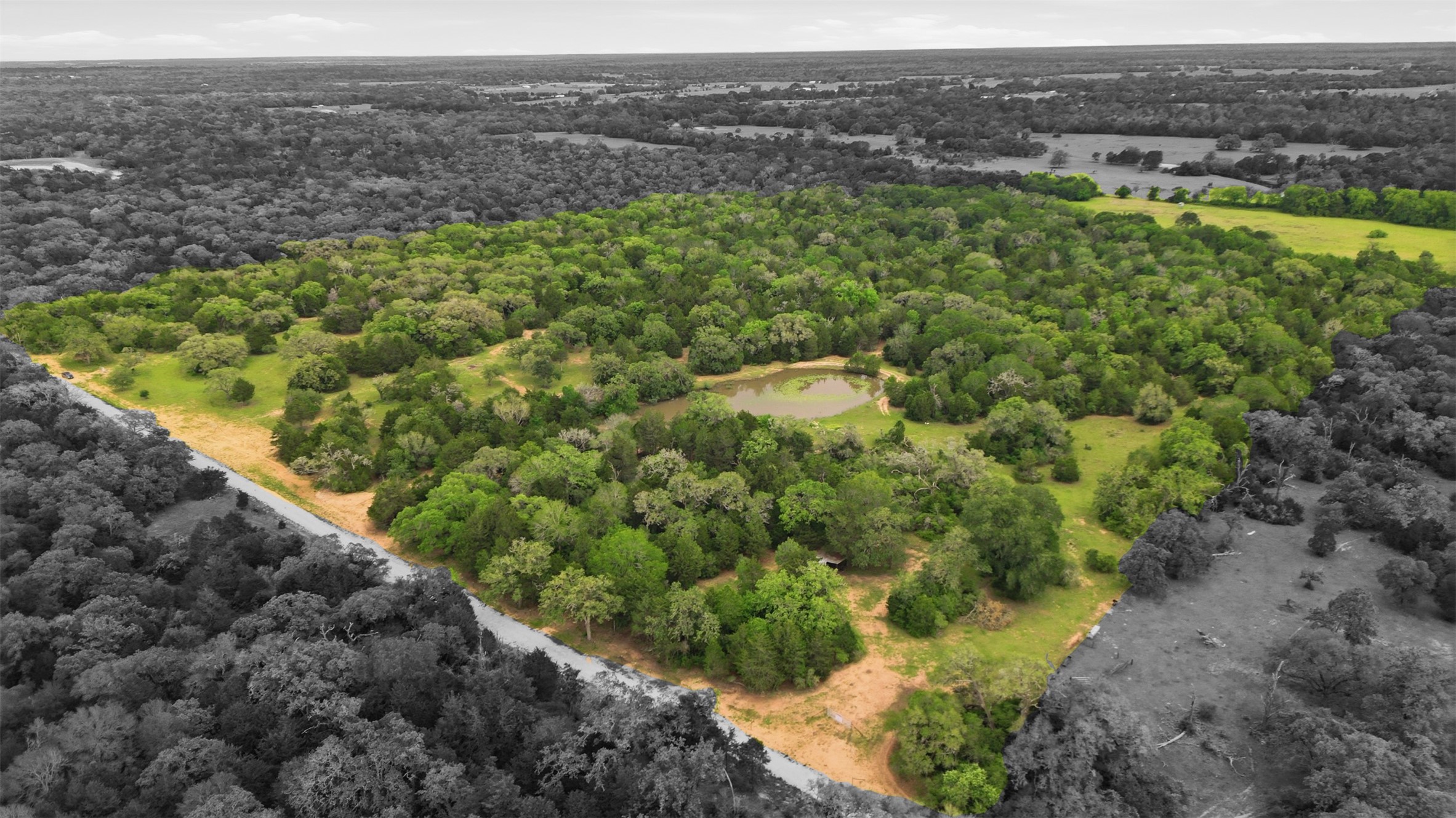1165 Cr 213 Road Weimar, TX 78962 - Photo 4 of 50 a view of a lake with a mountain and trees in the background