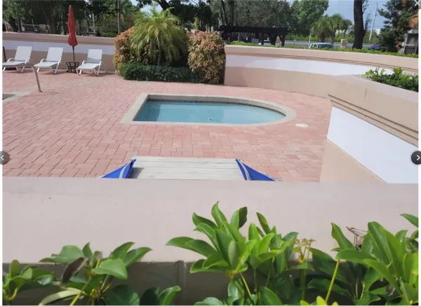 a view of a swimming pool with a porch