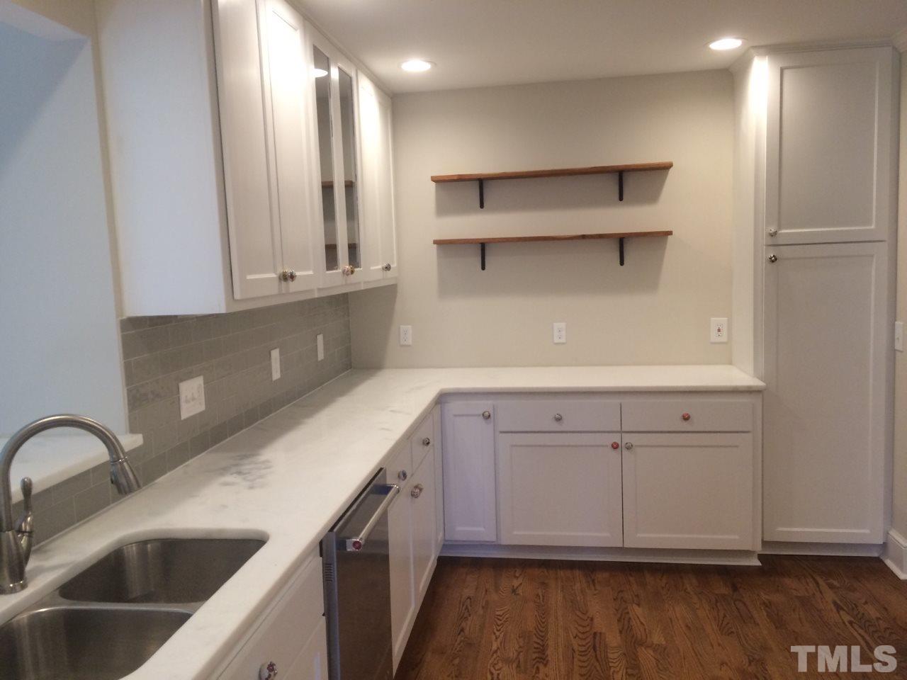 1317 Dixie Trail Raleigh, NC 27607 - Photo 9 of 25 Custom craftsman kitchen cabinets with white countertops.
