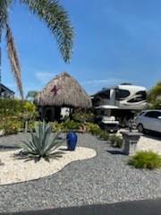 a view of a house with backyard sitting area and swimming pool