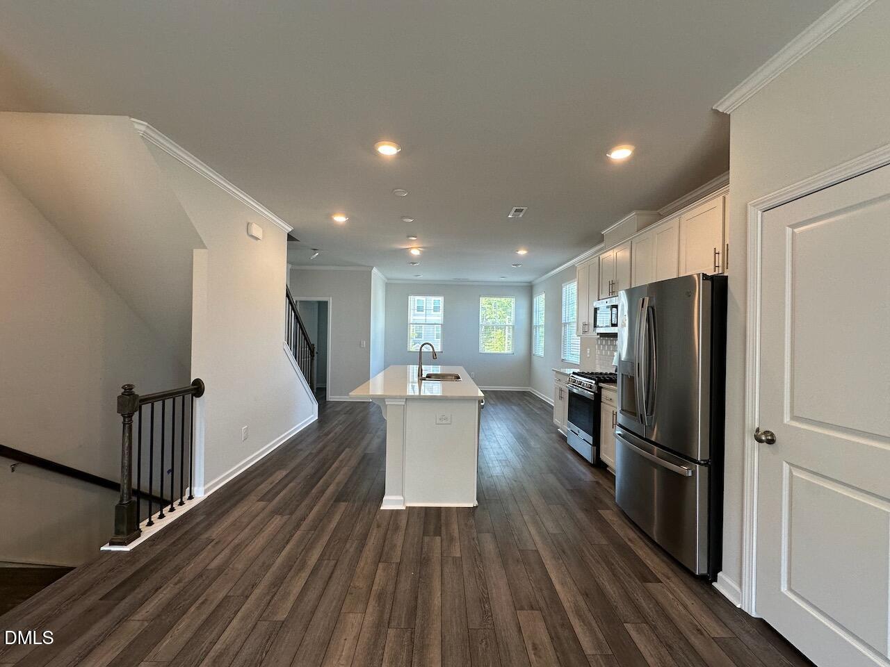 2521 Laurel Valley Way Raleigh, NC 27604 - Photo 9 of 25 a view of a kitchen with wooden floor and electronic appliances