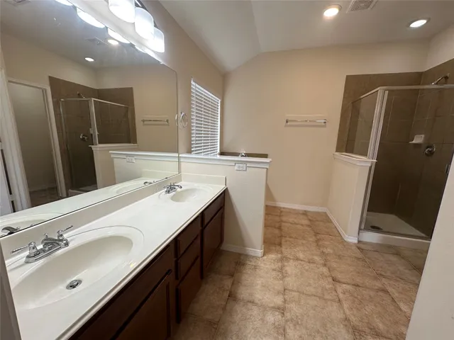 a bathroom with a bathtub and a shower