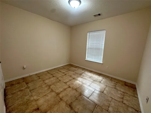 a bathroom with a sink a toilet a mirror and shower