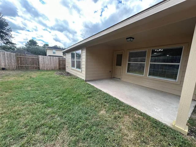 a view of a backyard with a small cabin