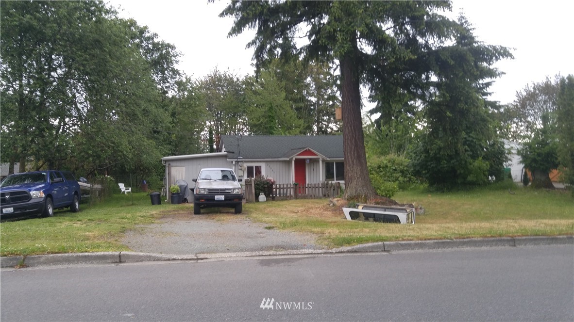 22925 Brier Road Brier, WA 98036 - Photo 1 of 1 a front view of a house with a yard and garage