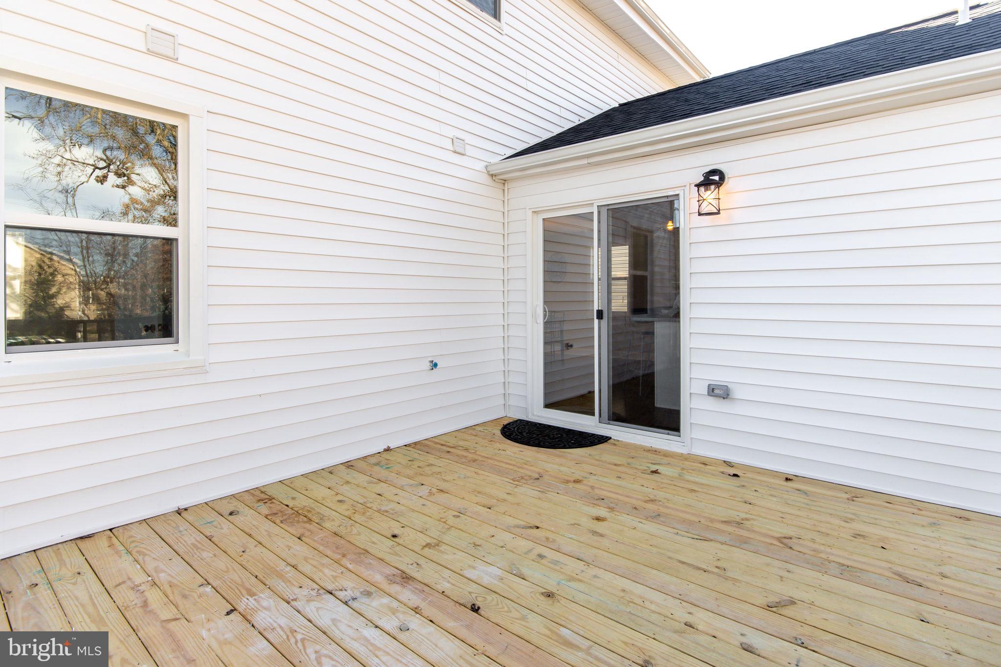 34 Evans Avenue Lutherville-Timonium, MD 21093 - Photo 11 of 36 Sliders from kitchen to deck