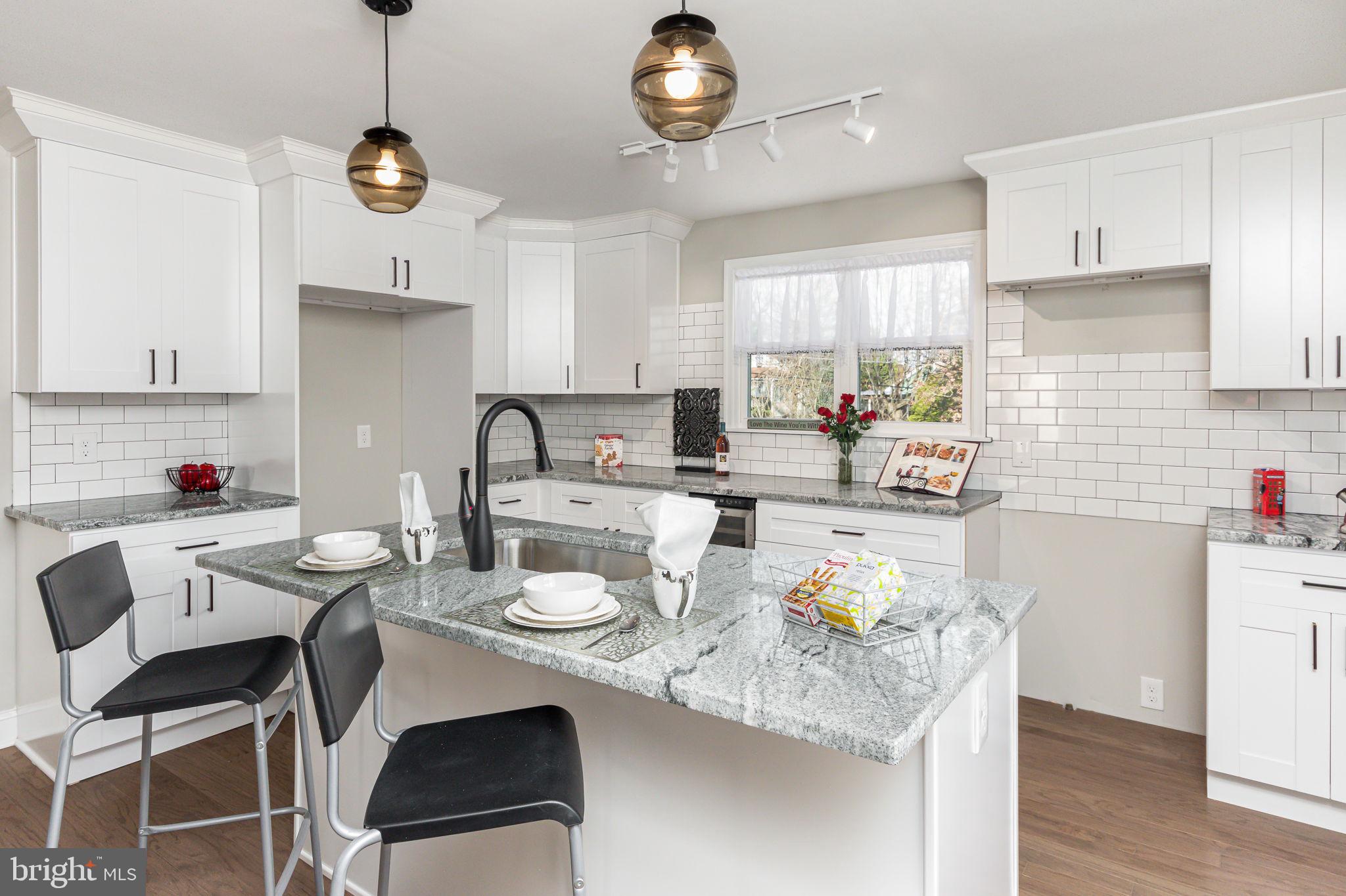 34 Evans Avenue Lutherville-Timonium, MD 21093 - Photo 6 of 36 Granite breakfast bar, appliances to be installed