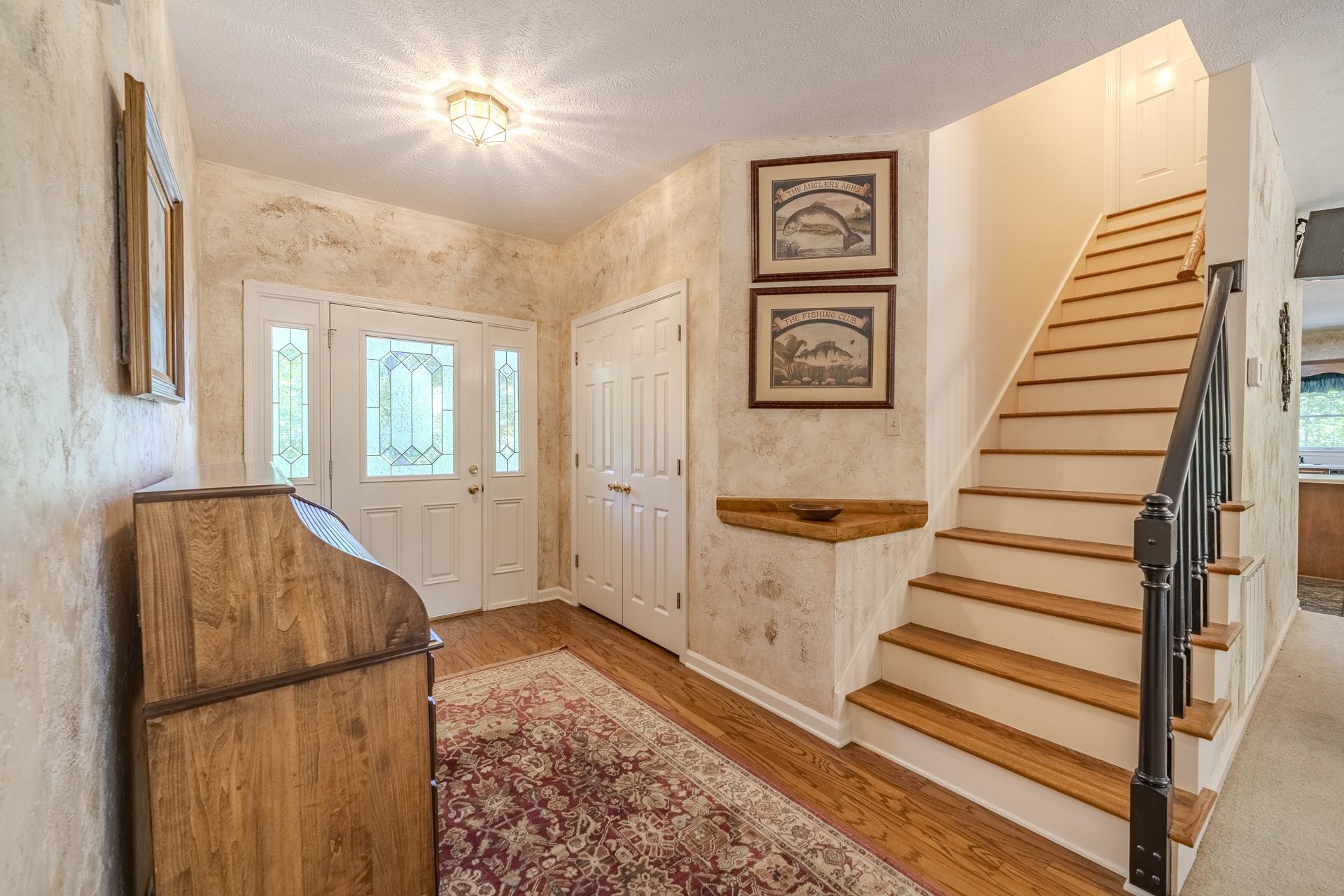 535 Old South Road Counce, TN 38326 - Photo 13 of 39 a view of a hallway with wooden floor and staircase