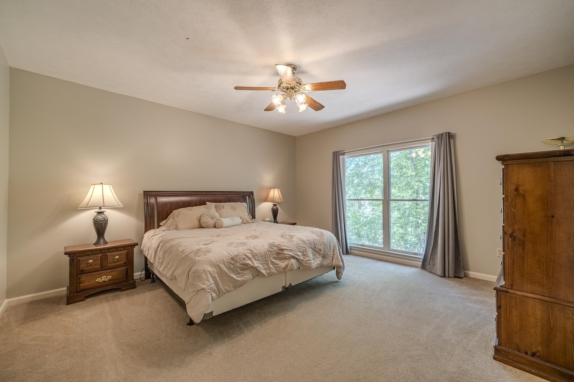 535 Old South Road Counce, TN 38326 - Photo 15 of 39 a bedroom with a bed lamp and a large window