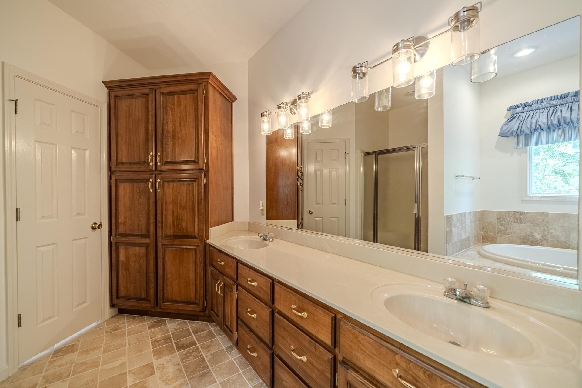 535 Old South Road Counce, TN 38326 - Photo 21 of 39 a spacious bathroom with a shower sink and mirror