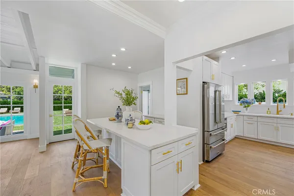 a kitchen with a table and chairs