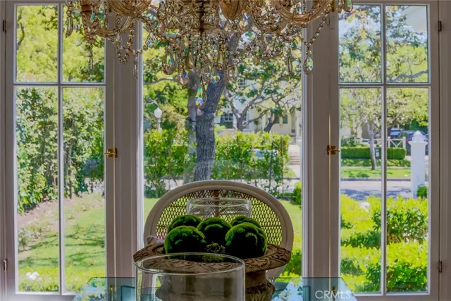 a kitchen that has a lot of cabinets a sink and wooden floor