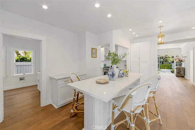 a wooden bench sitting in front of a house