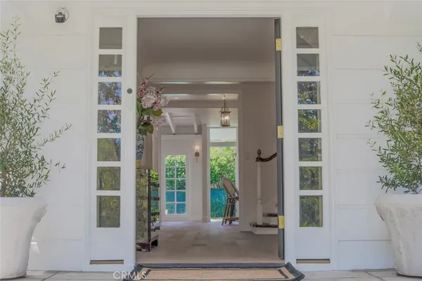 a view of entryway with wooden floor and stairs