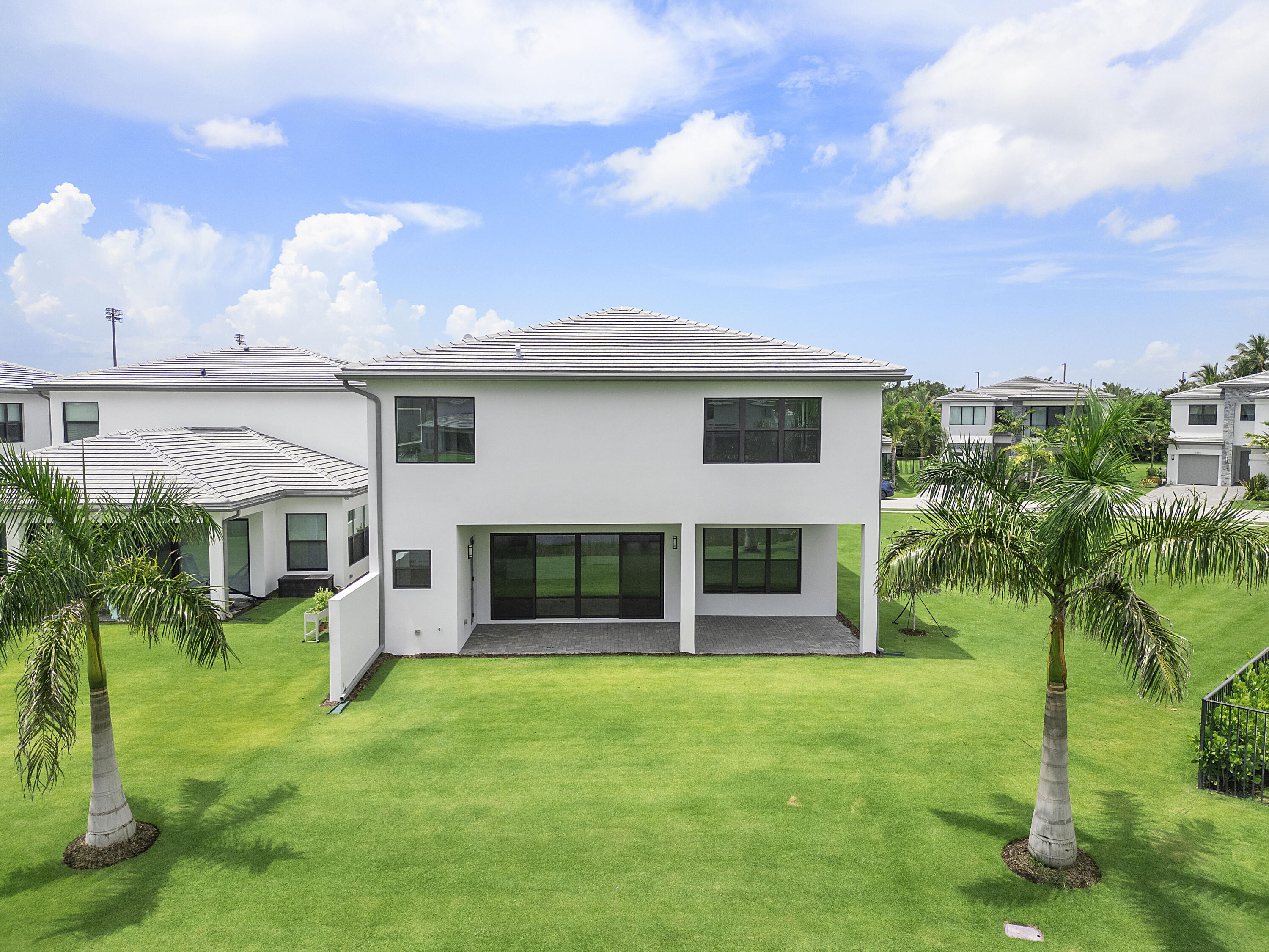 9322 Sunflower Mdw Road Boca Raton, FL 33434 - Photo 50 of 87 a front view of a house with a yard