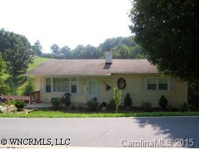 5064 Old Clyde Road Clyde, NC 28721 - Photo 1 of 6 front view of a house with a yard