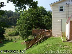 5064 Old Clyde Road Clyde, NC 28721 - Photo 2 of 6 a view of a deck with a small yard