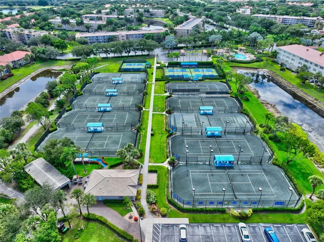 a room with chairs pool table and chairs