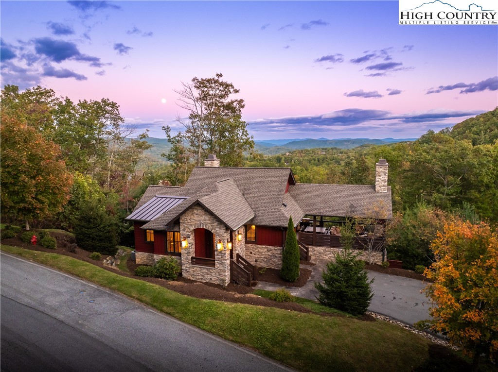 1253 Goldenrod Road Boone, NC 28607 - Photo 1 of 48 an aerial view of a house with a yard and lake view