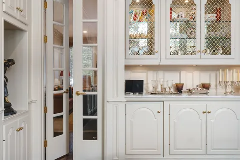 a bathroom with a sink vanity and a mirror