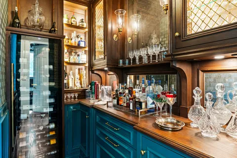 a kitchen with a stove a sink and cabinets