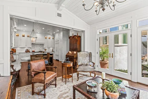 a view of a livingroom with furniture window and wooden floor