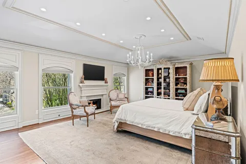 a spacious bathroom with a granite countertop sink mirror and a