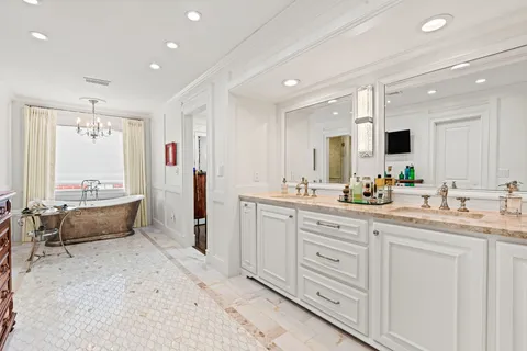 a bathroom with sinks and mirror