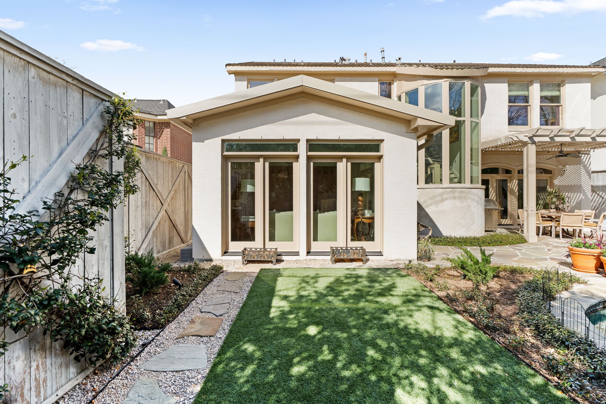 2017 Dryden Road Houston, TX 77030 - Photo 38 of 40 Then there's the turf - lush, tailored, and perpetually green. It offers softness without maintenance, making the entire yard feel polished year-round.