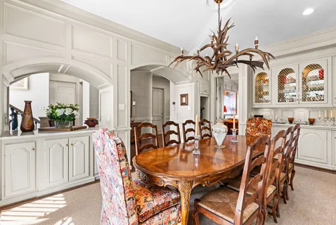 a kitchen with a window and cabinets