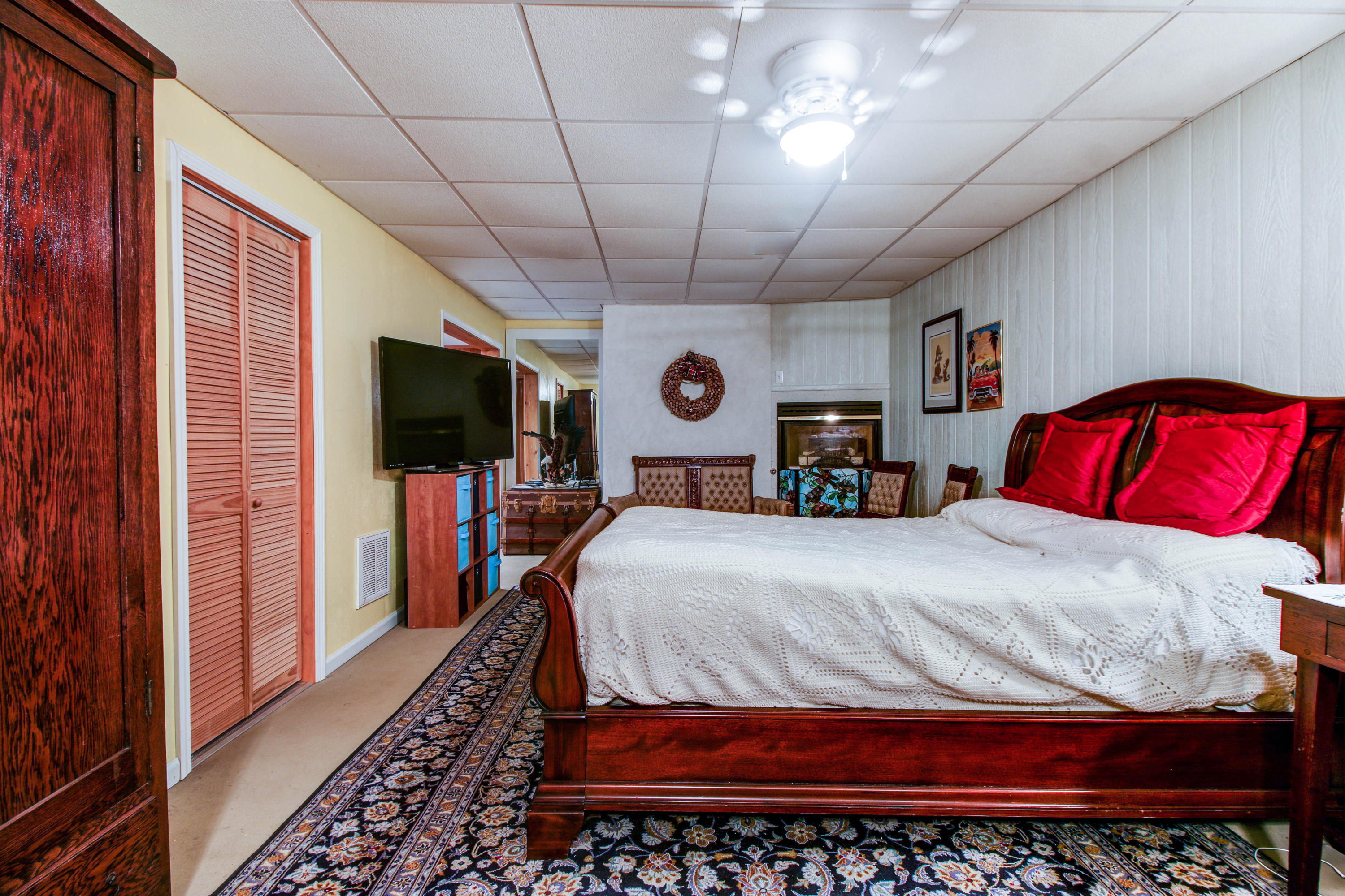 2020 Altice Mill Road Rocky Mount, VA 24151 - Photo 40 of 53 a bedroom with a large bed and a flat screen tv