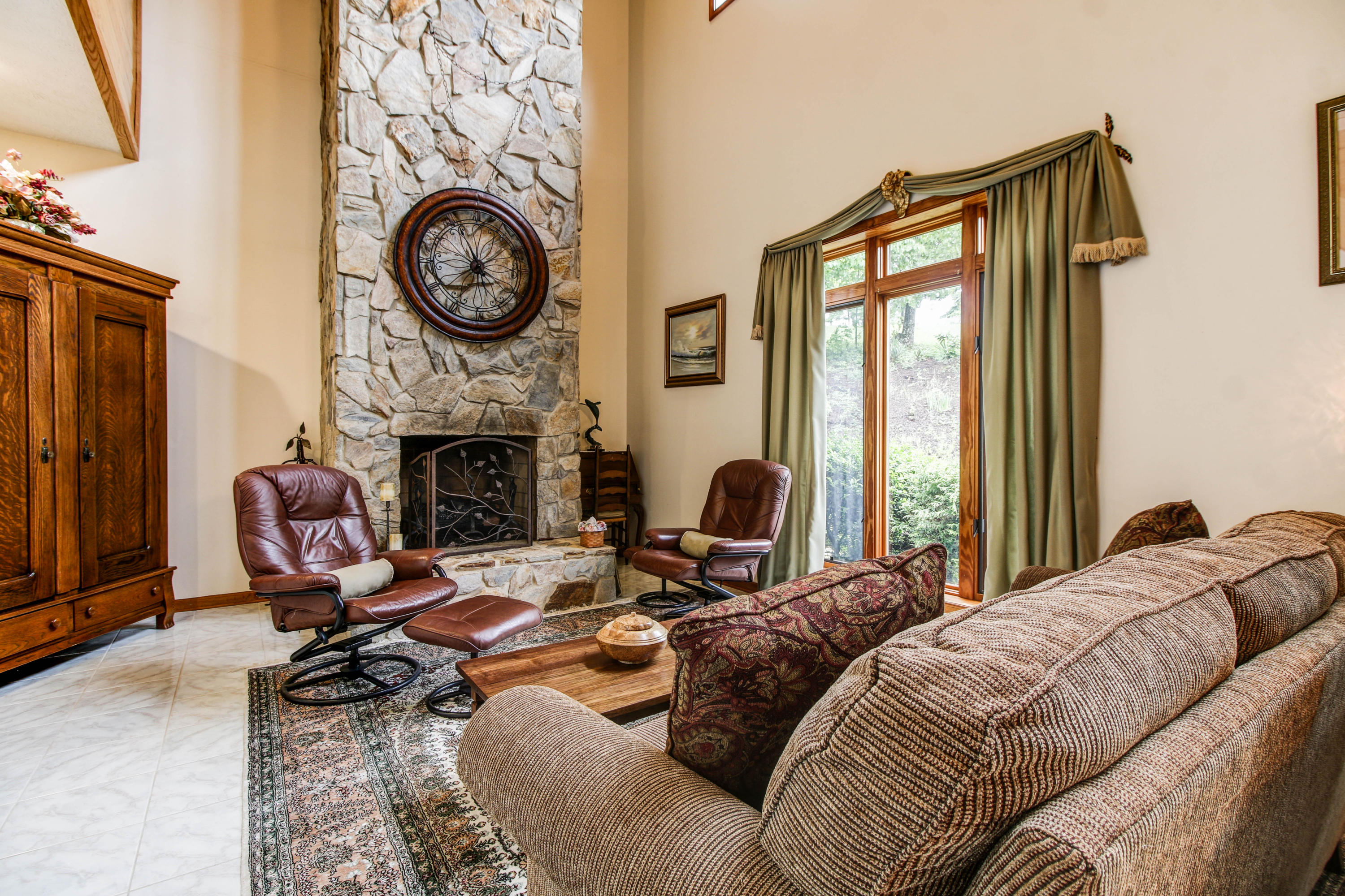 2020 Altice Mill Road Rocky Mount, VA 24151 - Photo 8 of 53 a living room with furniture a fireplace and a large window