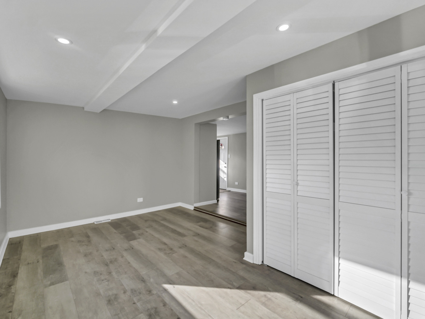 1820 Tomahawk Trail Round Lake Heights, IL 60073 - Photo 4 of 23 an empty room with wooden floor and windows